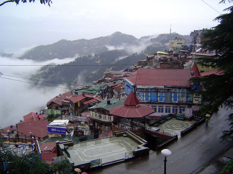 Down the ridges, metal-roofed wooden buildings sprawl.