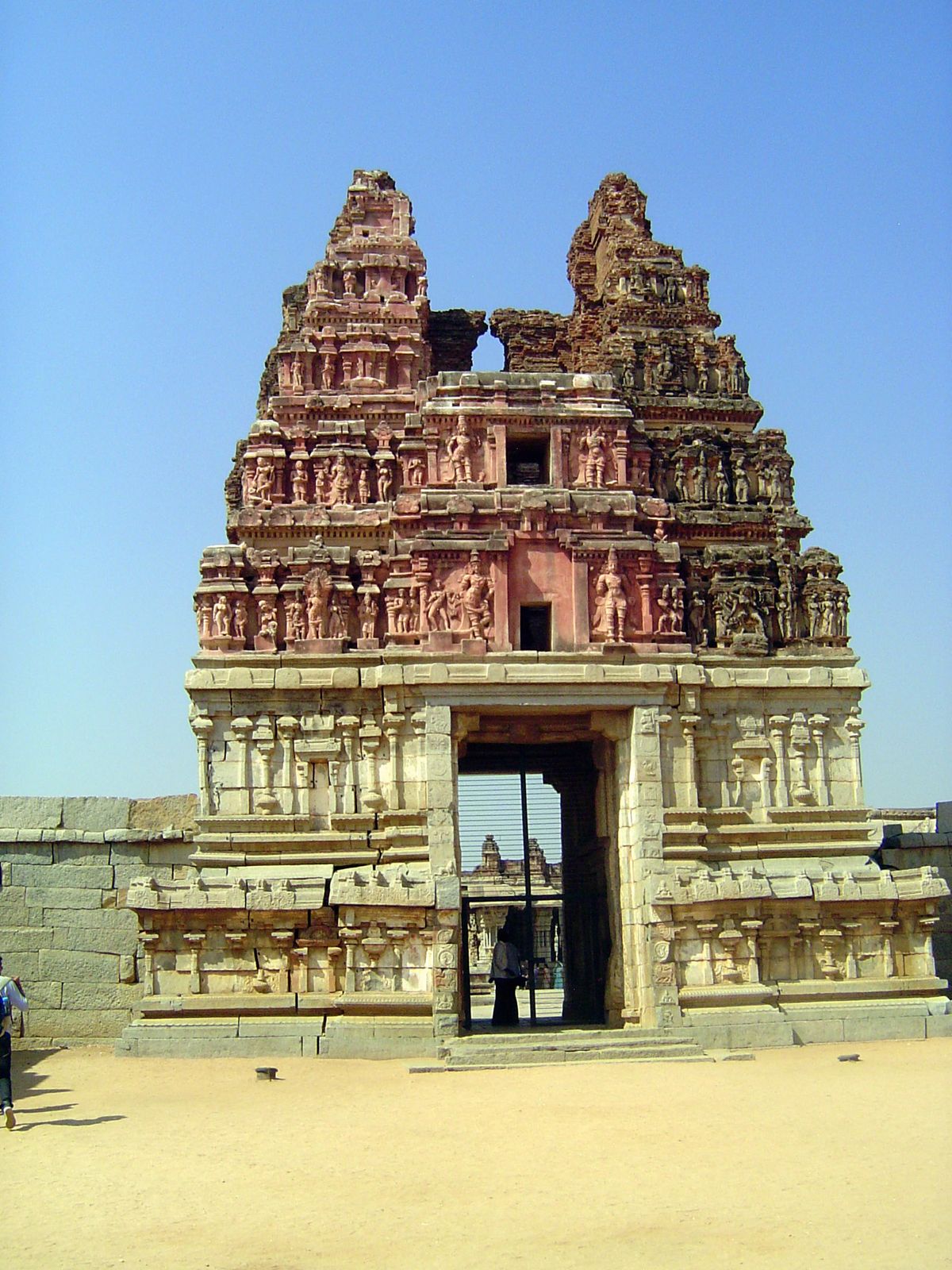 The gopura. It's half-complete paint job hints that the tower was on the edge of collapse before restoration. Five centuries ago, it was lik