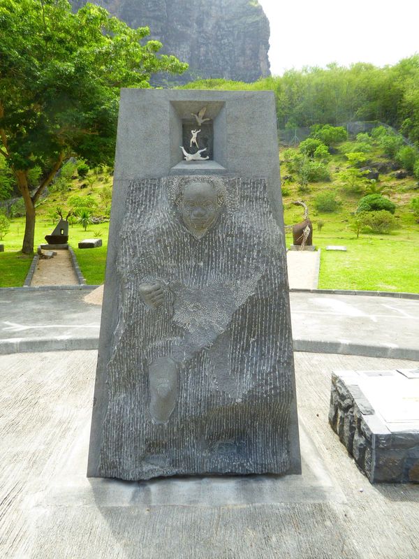 Emerging into freedom? The smaller figures at the top allude to the traditional belief that in 1835 the escaped slaves on the mountain kille