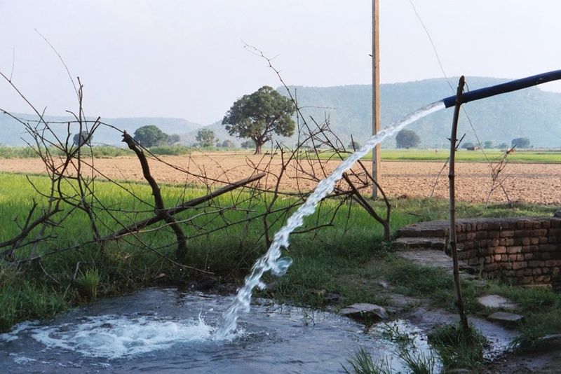Electric pumps lift groundwater. Ajaigarh stands on a safe and secure butte rising above these plains.