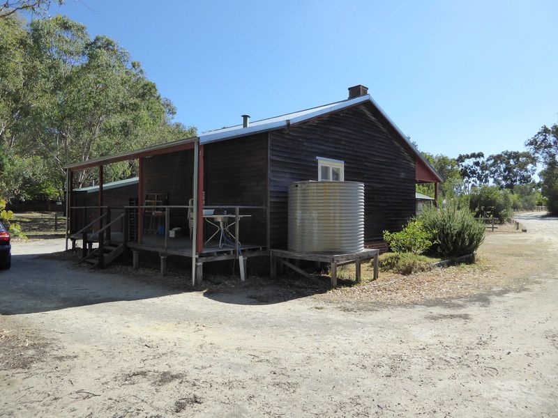 There are two verandas, and four interior rooms two 12 x 12 and two 12 x 14. There's a water tank for the kitchen, but there's no bathroom, 