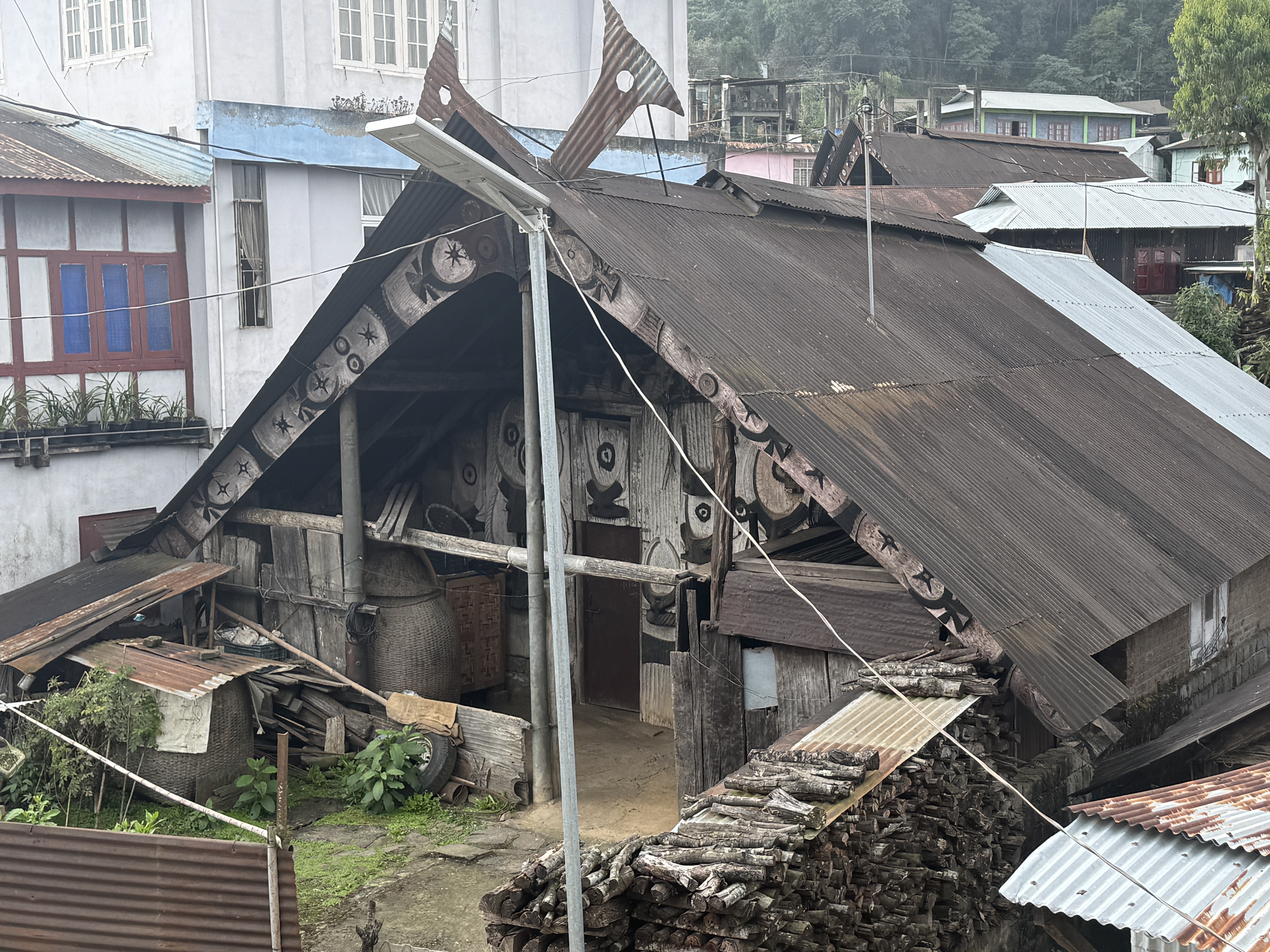 Here's a house built of modern materials yet fitted with house horns cut from sheetmetal.