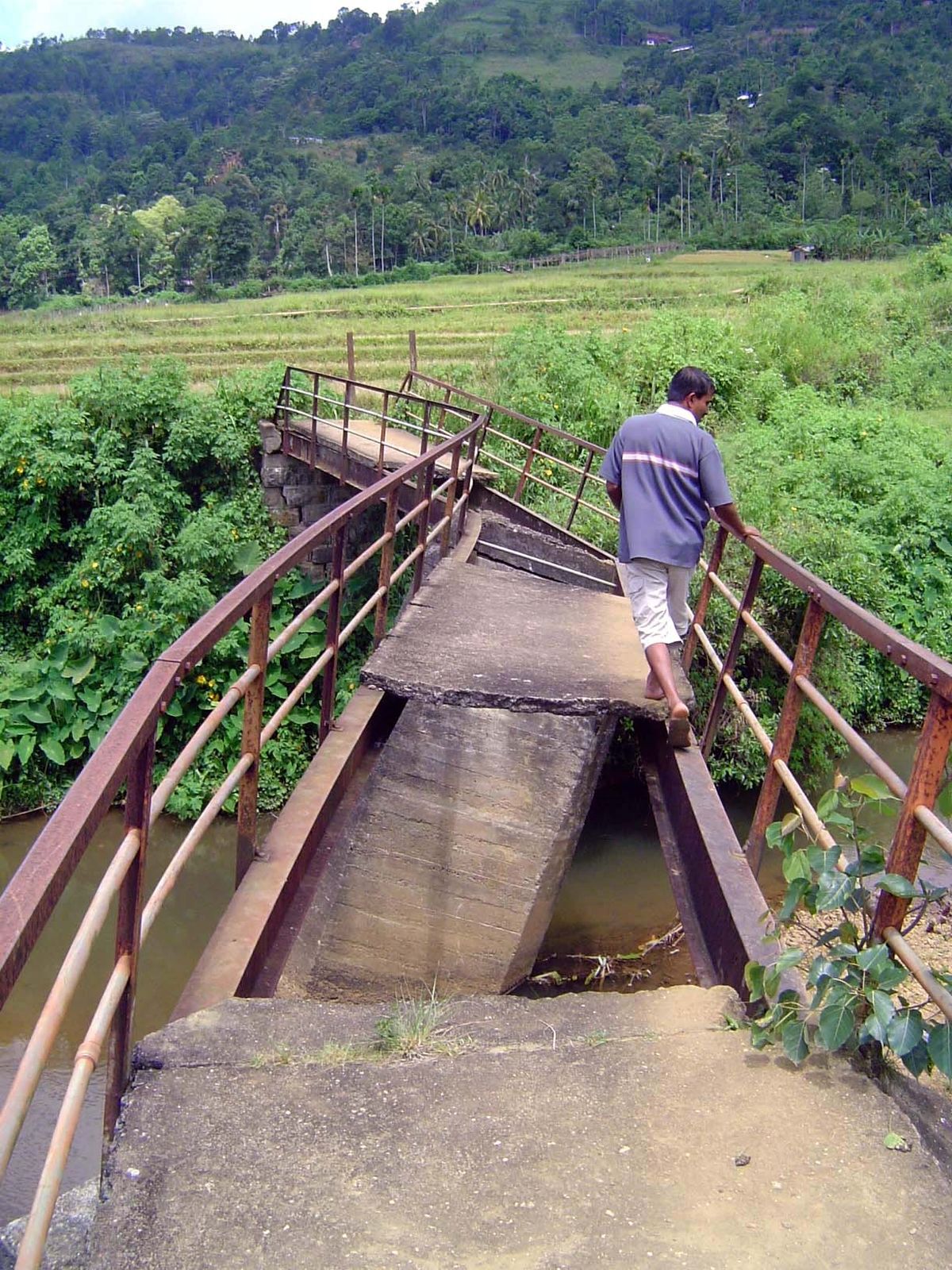 In the past, farmers walked from here to Kandy; now they're more likely to take a bus. Still, the infrastructure is poor—in this case, a nea