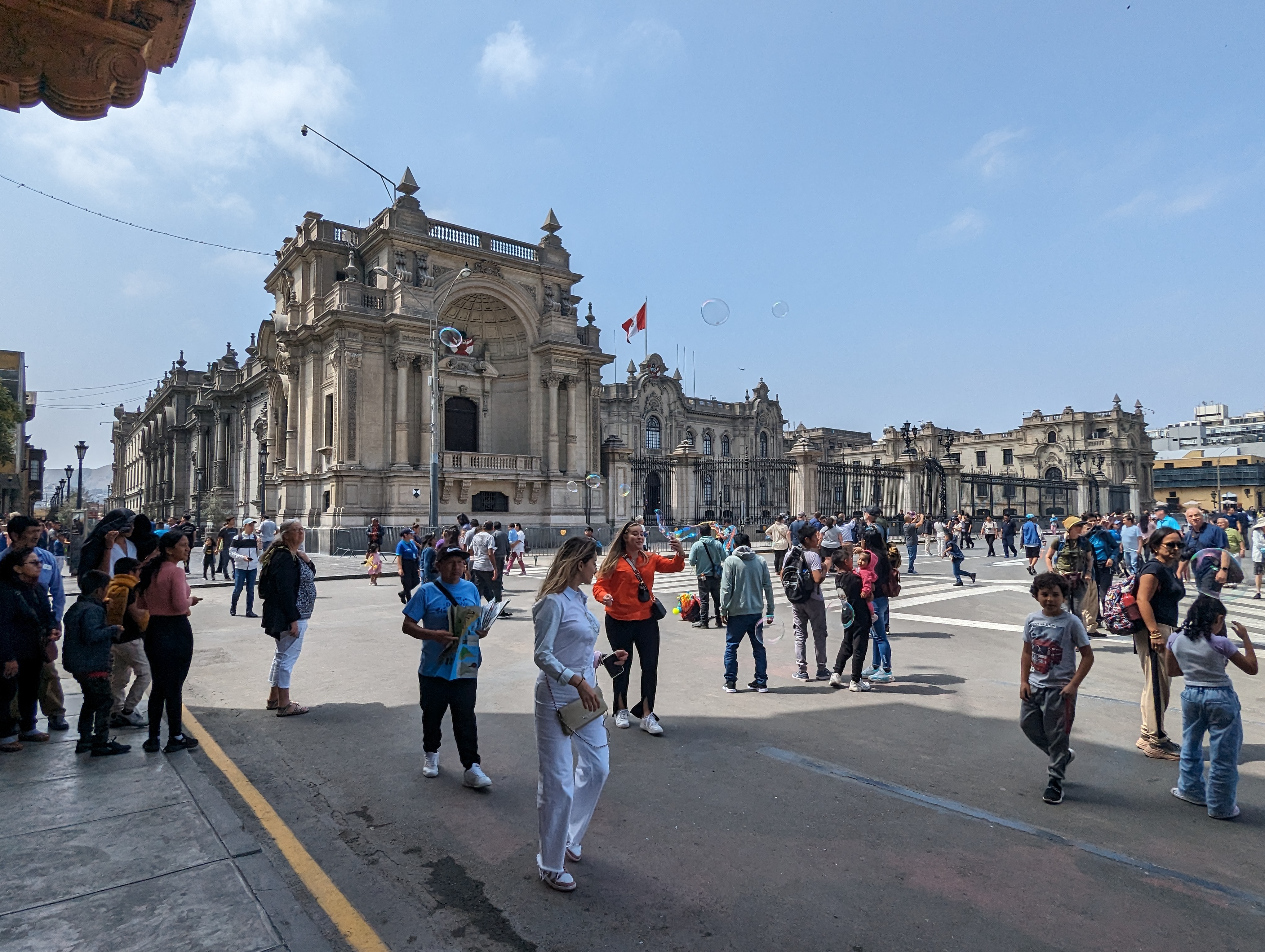 The presidential palace fronts both on the Plaza Mayor or Plaza de Armas and on the other side the none-too-scenic river.  Crowds?  It's a w