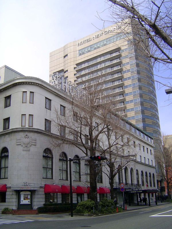 The New Grand Hotel, 1927. MacArthur is said to have set out here on that day in 1945 when—no tie, open collar—he met the Japanese on the de