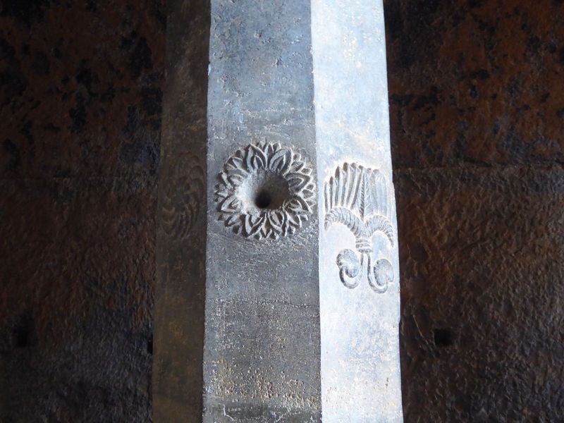 Some of the columns have decorative features, usually of flowers. The one on the right Burgess takes to be a fan.