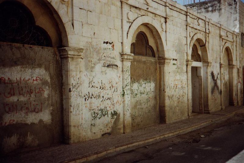 Because the old city lies on a ridge with roads on contours, this building looks like a one-story warehouse. Come round to the back side.