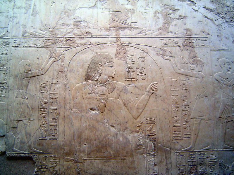 Ramose died young, and the walls were never painted. Still, they were carved to perfection. Here, priests pour purifying water over Ramose, 