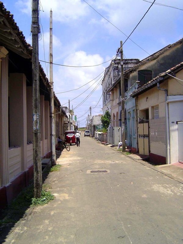 Walk down the street away from these public buildings and you're likely to be approached by a real-estate tout, quick to explain what it wil