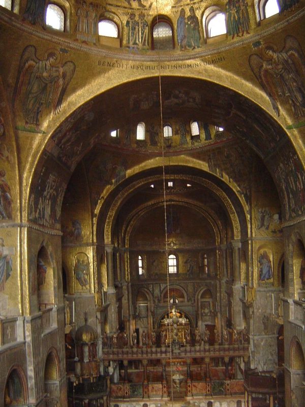 The basilica was built in 1063-94 on a Greek-cross plan, with four arms of equal length. The whole structure is "incrusted," to use Ruskin's