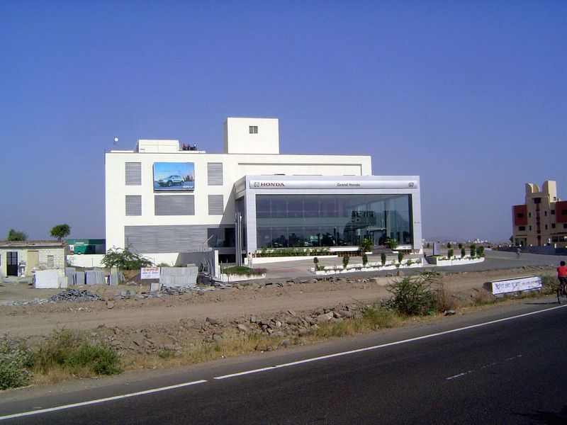 One of many car dealerships along the highway.