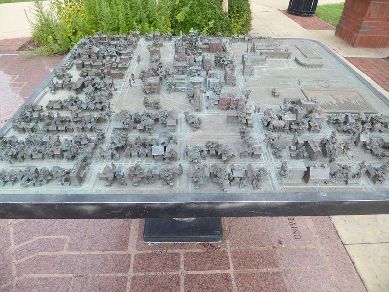 The display is a painstaking model of the university and its neighborhood about 1930. The view is from the west, looking over the university