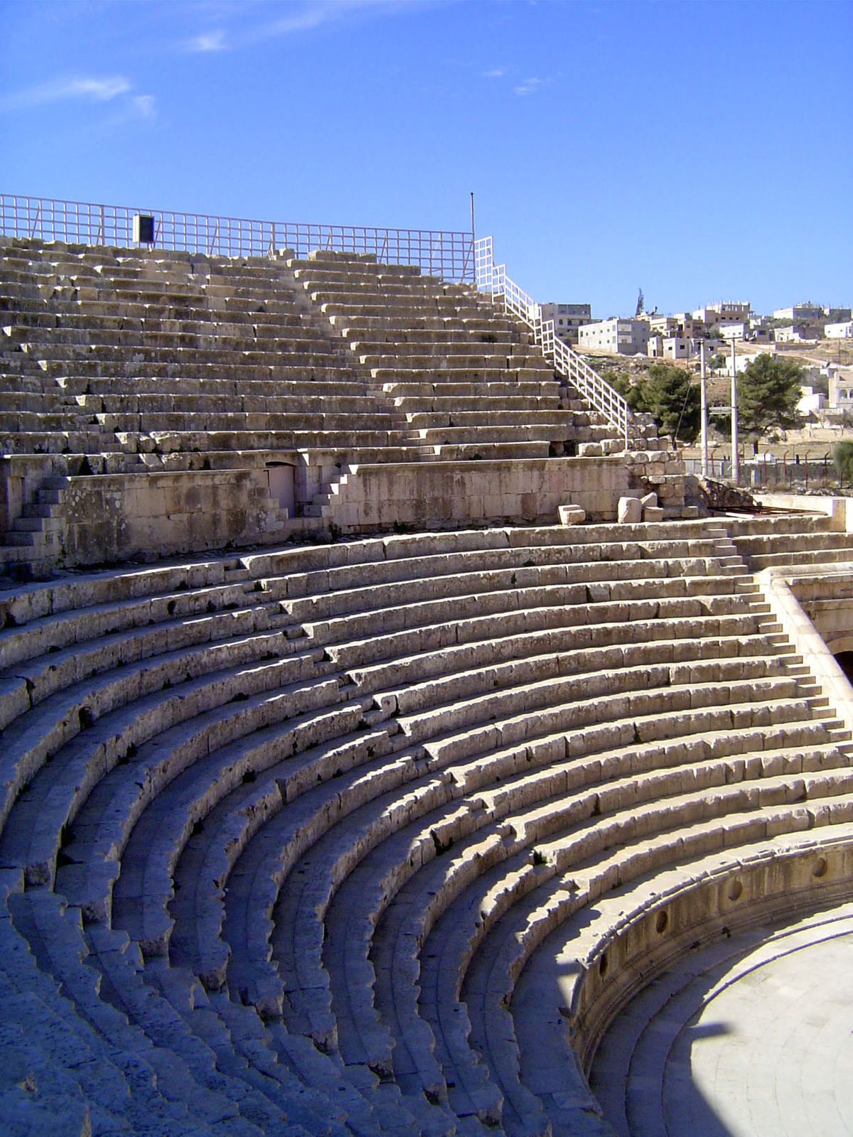 This is the South Theater, which adjoins the Temple of Zeus. It was built in two phases, plainly distinguished by a lower section carved fro