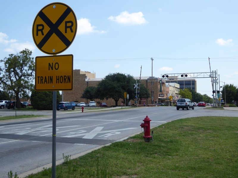 Most remarkably, the two dozen or so trains that pass through town daily no longer sound their horns at any of the grade crossings. This can
