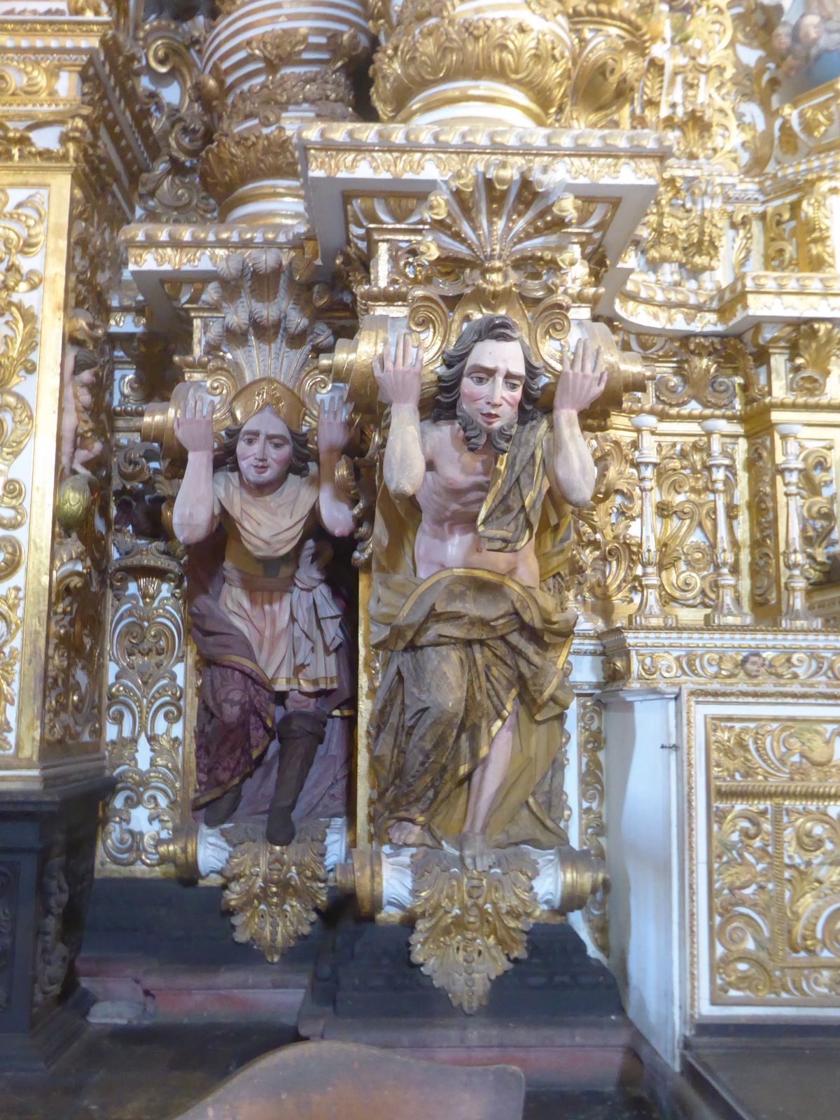Do those telemons colossal male figures or atlantes represent historic figures? If so, who?