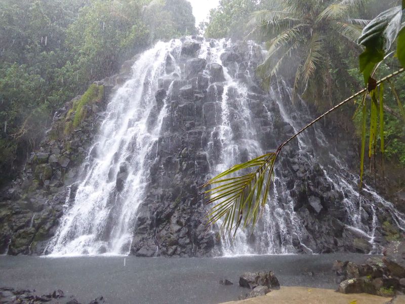 The same rock is found in lots of places around the island, including here at Kepirohi Falls, caught here during a cloudburst. The rain is w