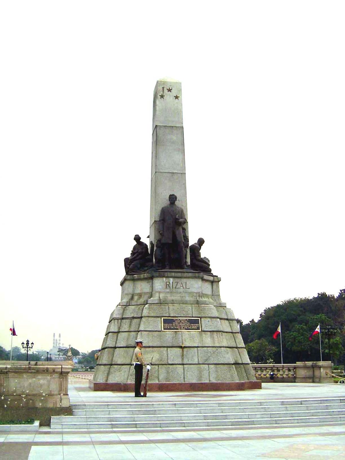 Nearby, ironically, is the guarded monument honoring Jose Rizal 1861-1896, who the Spansh executed. The view down the park gives a sense of 