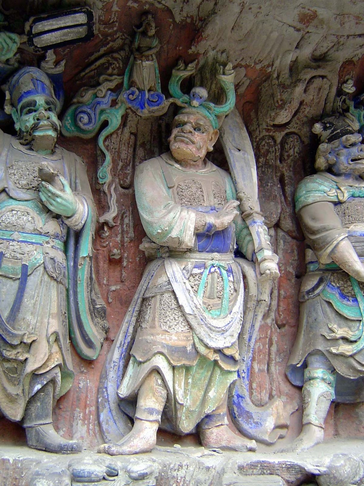 The smaller figures above them are their emanations.
