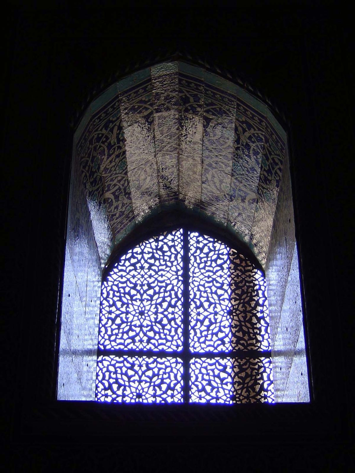 Windows are deeply recessed and perforated to reduce the blindingly bright summer light.