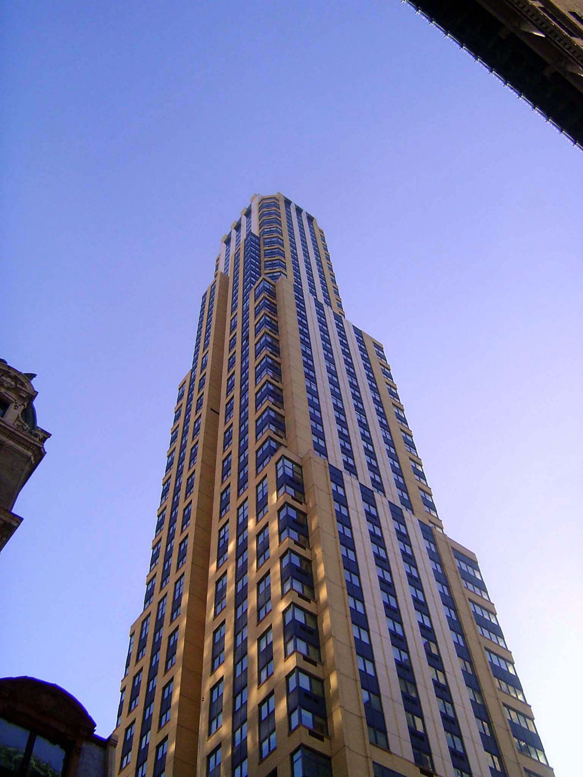 The name is simply 425 Fifth Avenue. The architect was Michael Graves. The building opened in 2003 and has been described as "among the ugli