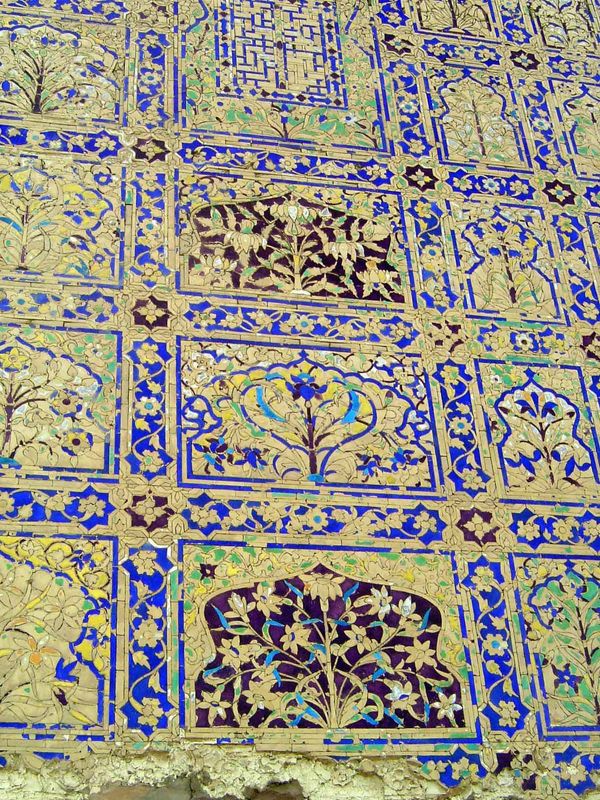 Still closer. The technique was complex. A 2-inch layer of plaster was laid. Then a 1-inch layer, into which tiles 5/8 of an inch thick were
