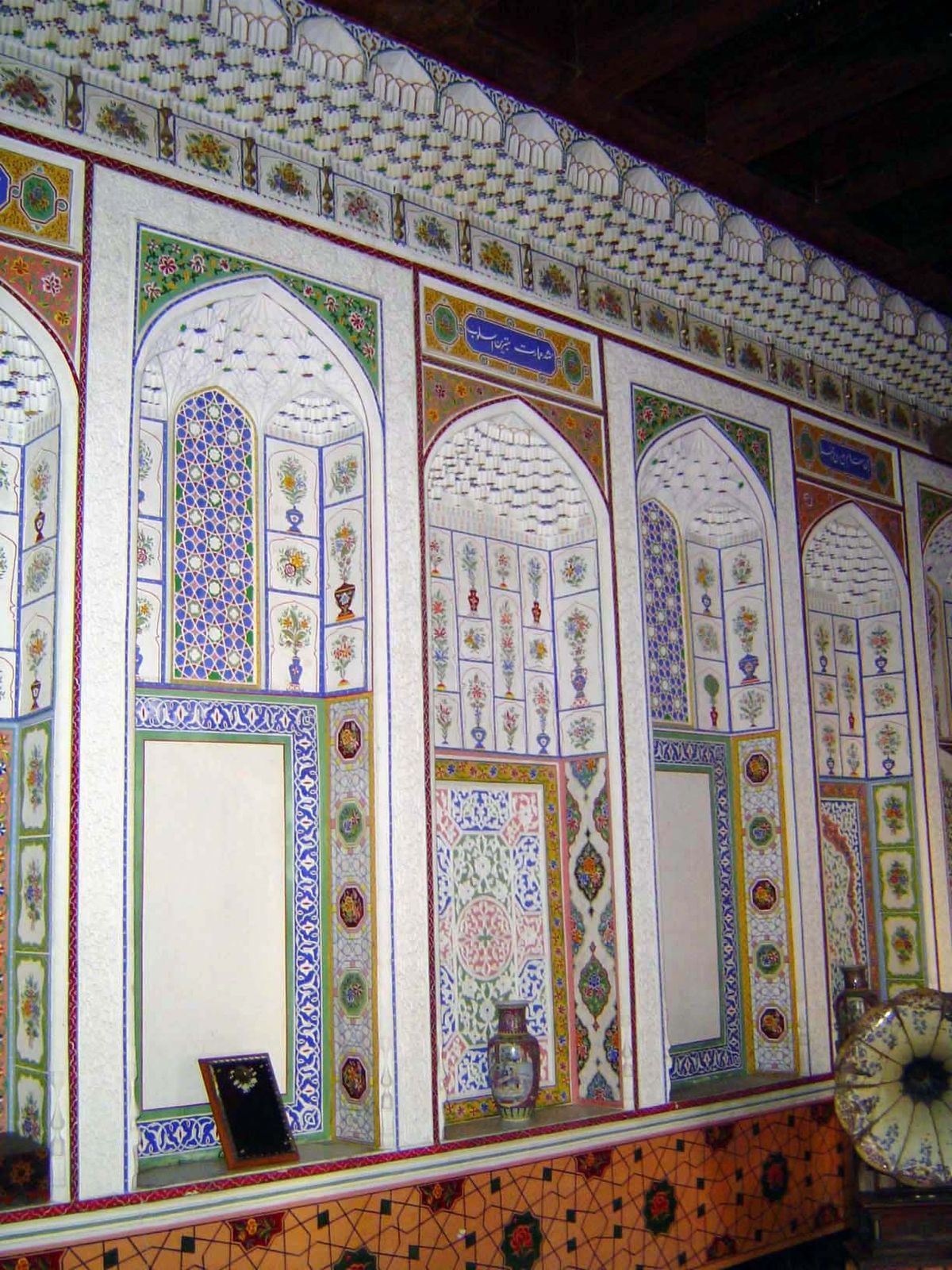 The entire length of the room is ornamented with ganch panels.