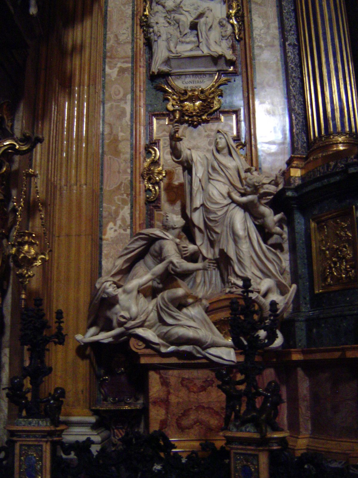 The sculptural group on the left is "The Triumph of Religion over Paganism."
