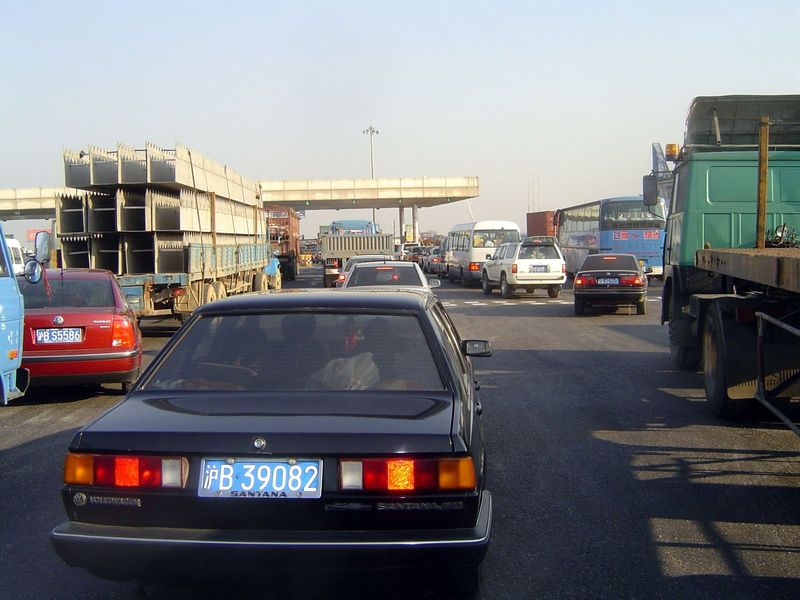 Down the road a bit, a toll plaza. You have to pity the tourist who goes to China in search of storybook exoticism.