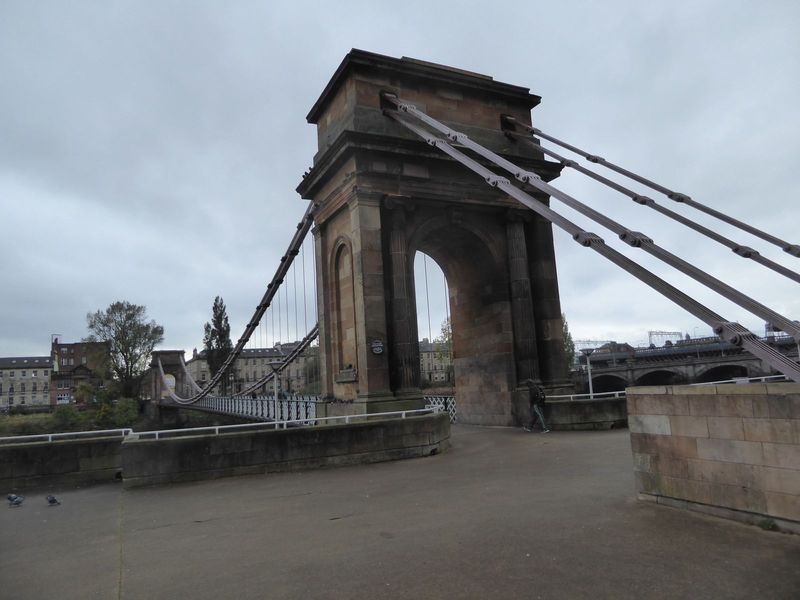 It's the Portland Street Suspension Bridge or simply the Clyde Suspension Bridge, a financial disaster for the promoters who hoped on comple
