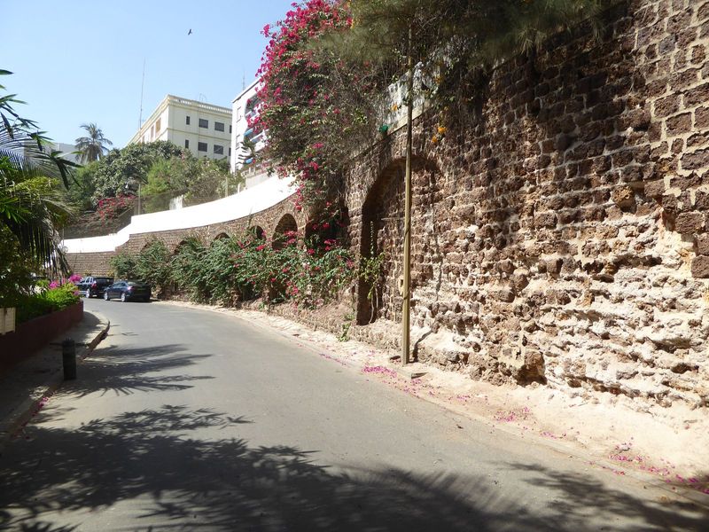 The beach was probably cleaner in years past. The road is the East Corniche.