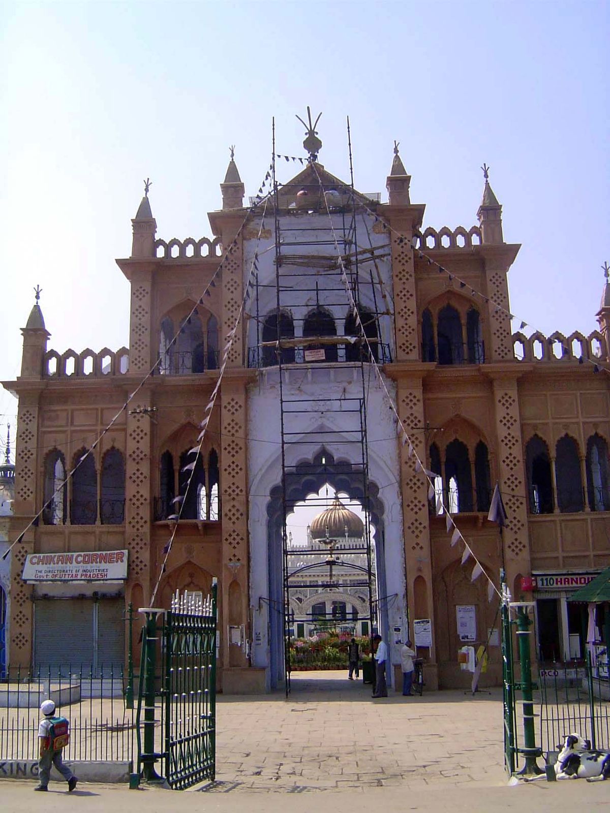 View from across the street; the imambara itself is straight ahead, with the gold dome.