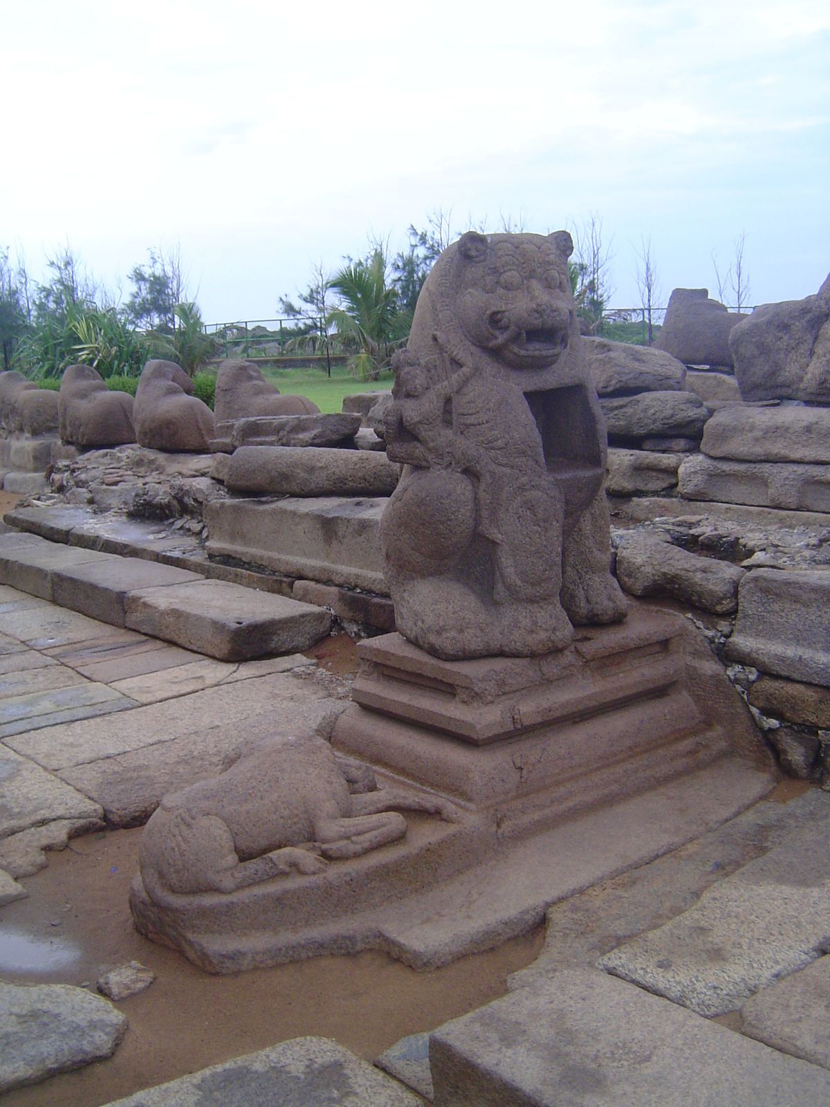 Outside, there's a lion with a shrine set into its chest. Note the headless buffalo. That's no accident.