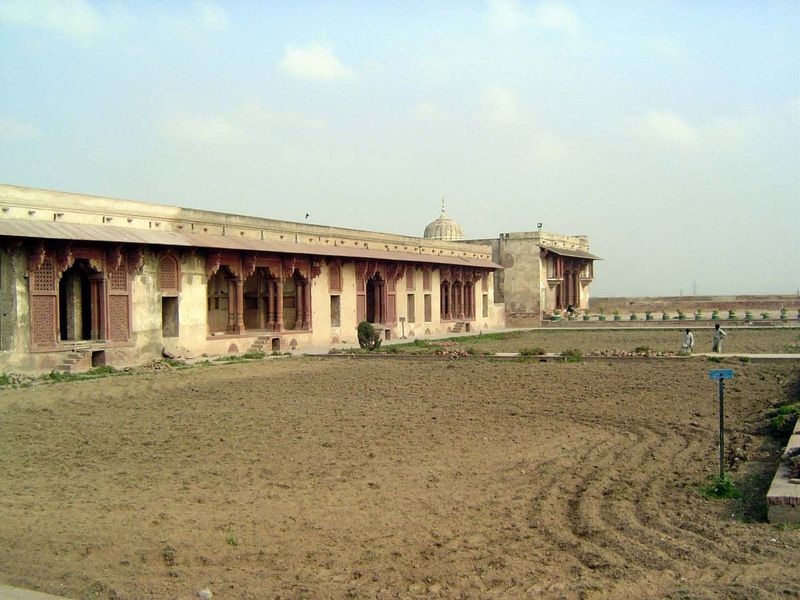 The sides of the quadrangle are rimmed with dalans or porticos. We'll take a closer look at that building at the far end.