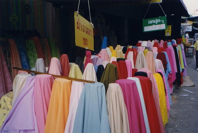 Chiang Rai's old market has not yet been upgraded for tourists. When it is, these cheap fabrics will be gone—available only in malls outside