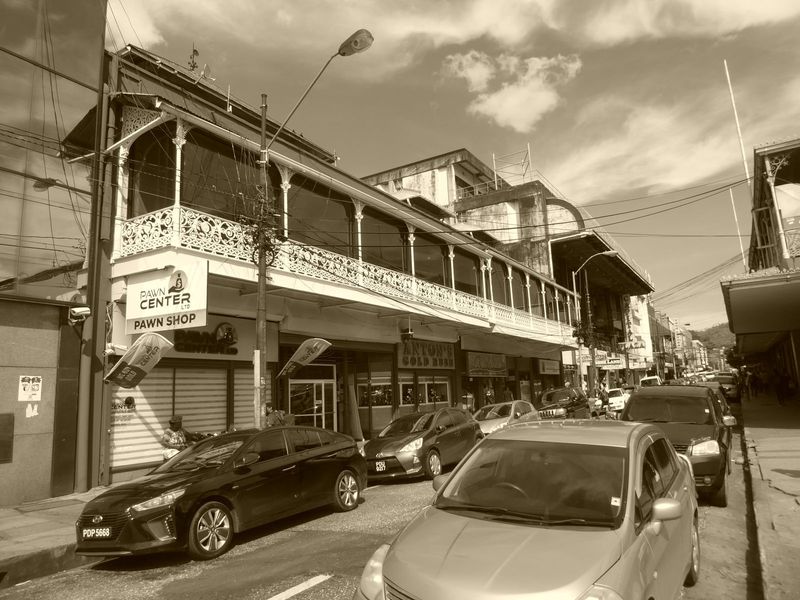 The old commercial core was gridded with mostly narrow streets and buildings designed for the weather. Most of those old balconies have been