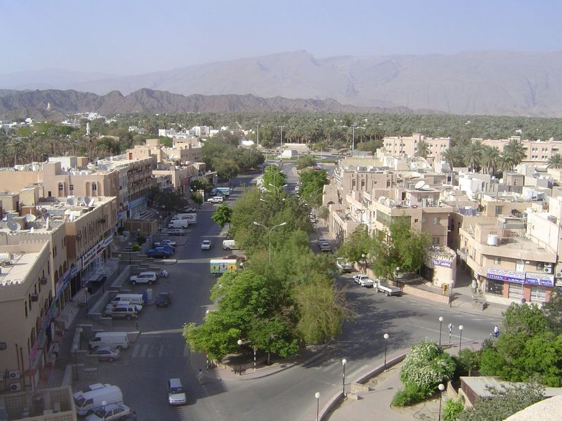 Looking north over the town center. There are banks on both sides of the street, and they're equipped with ATMs.