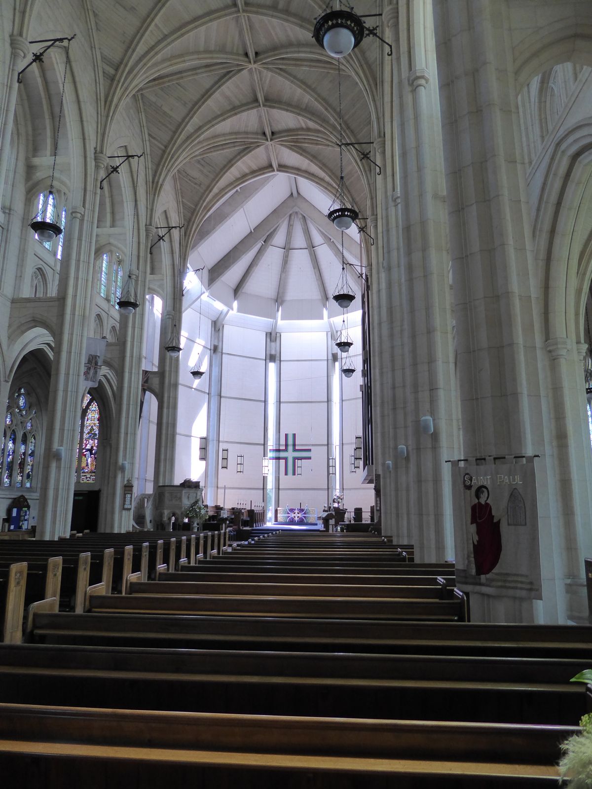 The nave is roofed with vaulted limestone; you just have to overlook the chancel, completed in 1971 with an acrylic hanging cross.