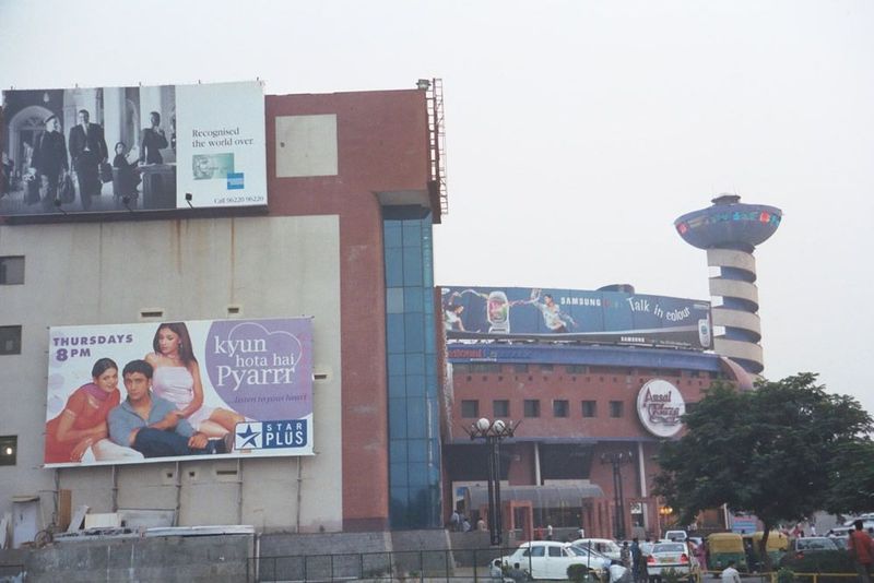 In Ansal Plaza, Delhi got its first proximal shopping center. The billboard advertises a TV show broadcast between 2002 and 2004 and so appr