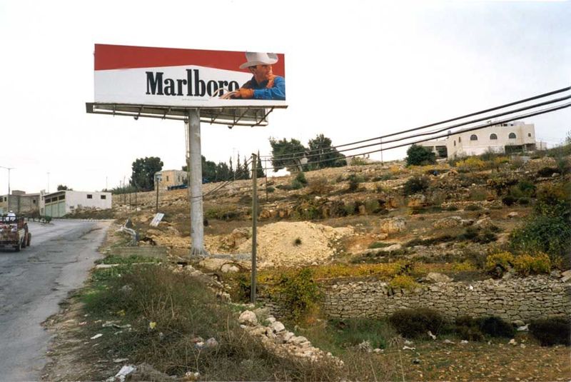 The Palestinians themselves didn't do their cities many favors, either. One company had the rights to erect pole signs at the entrances to a