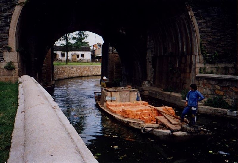 A load of bricks, driven by a noisy outboard motor.