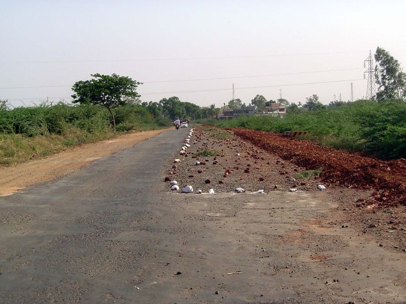 Road under construction. Forget cones and flashing lights. The white rocks are OK in daylight.