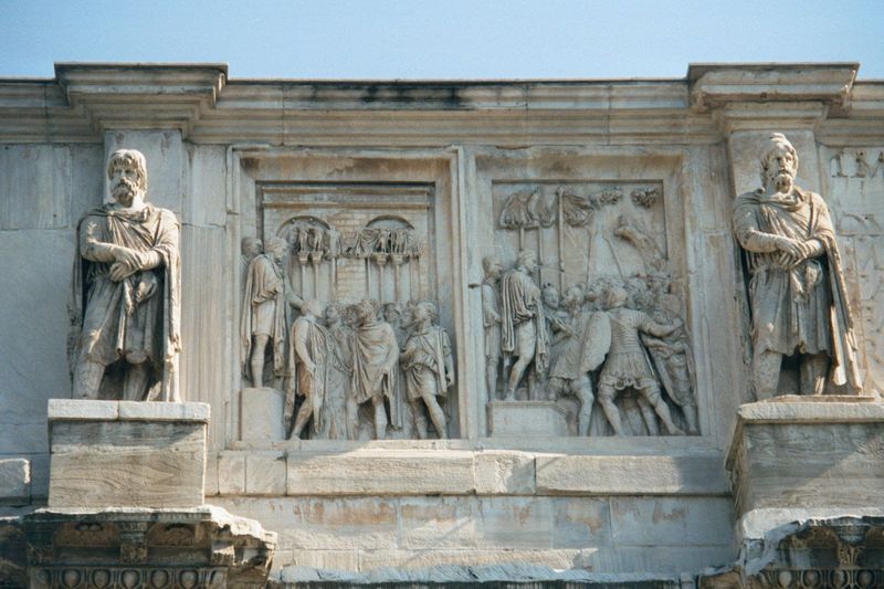 Here is part of the south face. The reliefs are from a second century monument to Marcus Aurelius and show him orating. The statues of capti