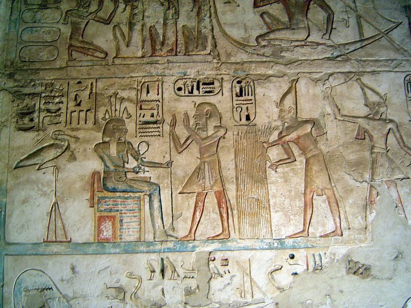 In the same room, Ramesses III worships Hapy, the Nile god, who holds the symbols of life. Behind Hapy is the Benu bird, father of the gods.