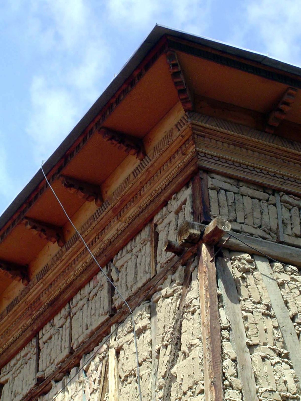 The overhanging cornice helps keeps the adobe dry.