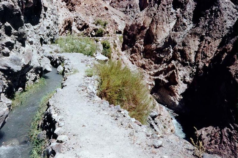 The natural channel drops quickly, so the artificial one soon is high above it.