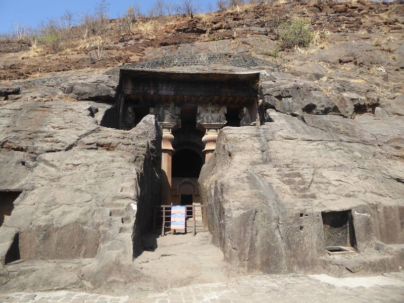 Bingo. Here's Burgess again: the prayer hall or chaitya is "reached by a passage 12 or 13 yards in length, cut through the rock, left in fro