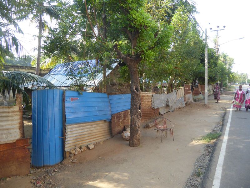 Housing in Jaffna and across the peninsula surrounding it is usually obscured by fencing, most commonly cheap metal sheeting. The view here 