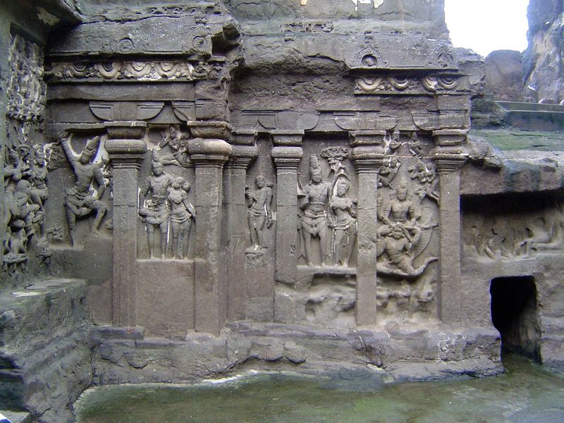 On the side of the temple base, there are figures of Shiva and Vishnu on an anthropomorphic Garuda.