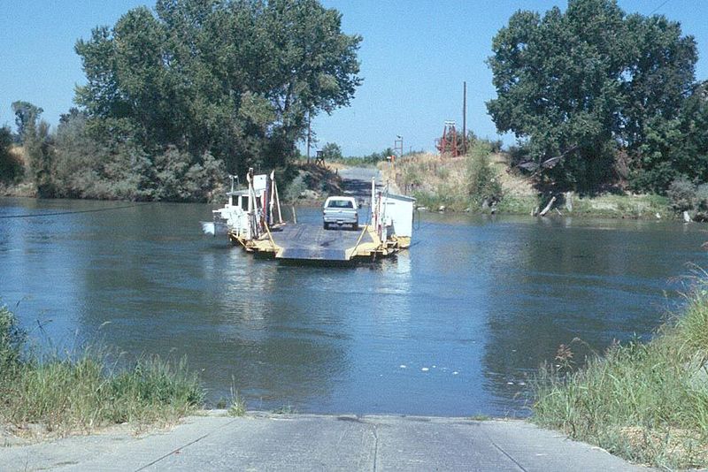 Farther north, an archaic automobile ferry crosses the Sacramento River.