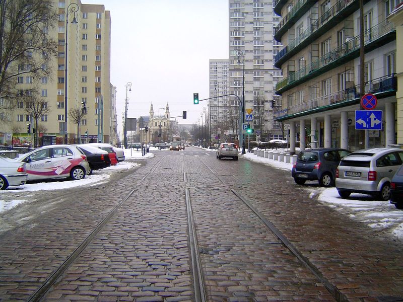 Chlodna Street, once a main street too important to be closed off even though it ran through the ghetto. A fenced bridge over the street at 